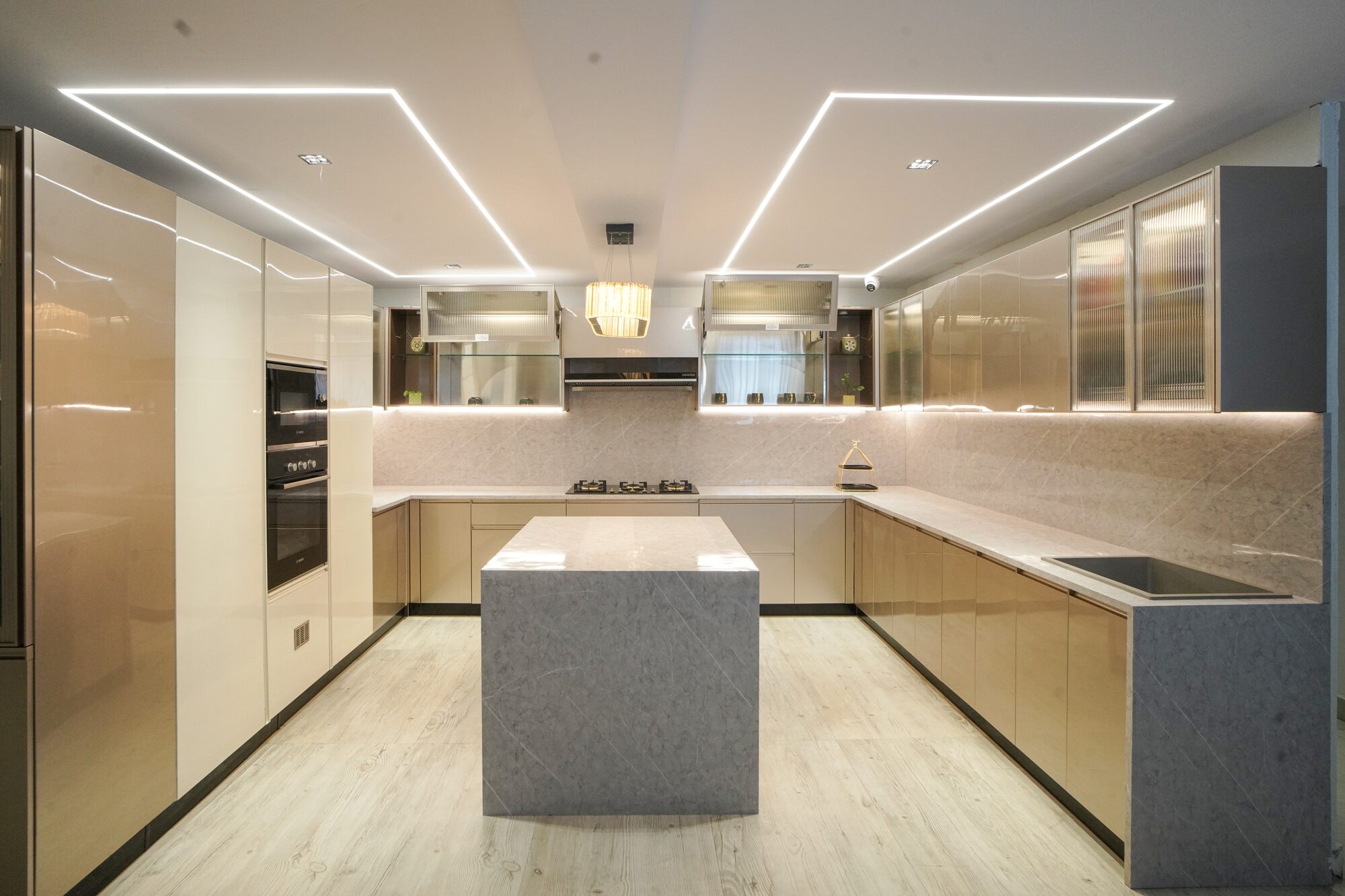 Island modular kitchen in champagne gloss finish