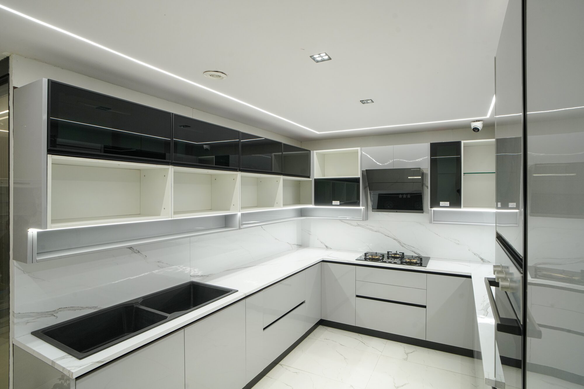 U-shaped modular kitchen in monochrome gloss finish